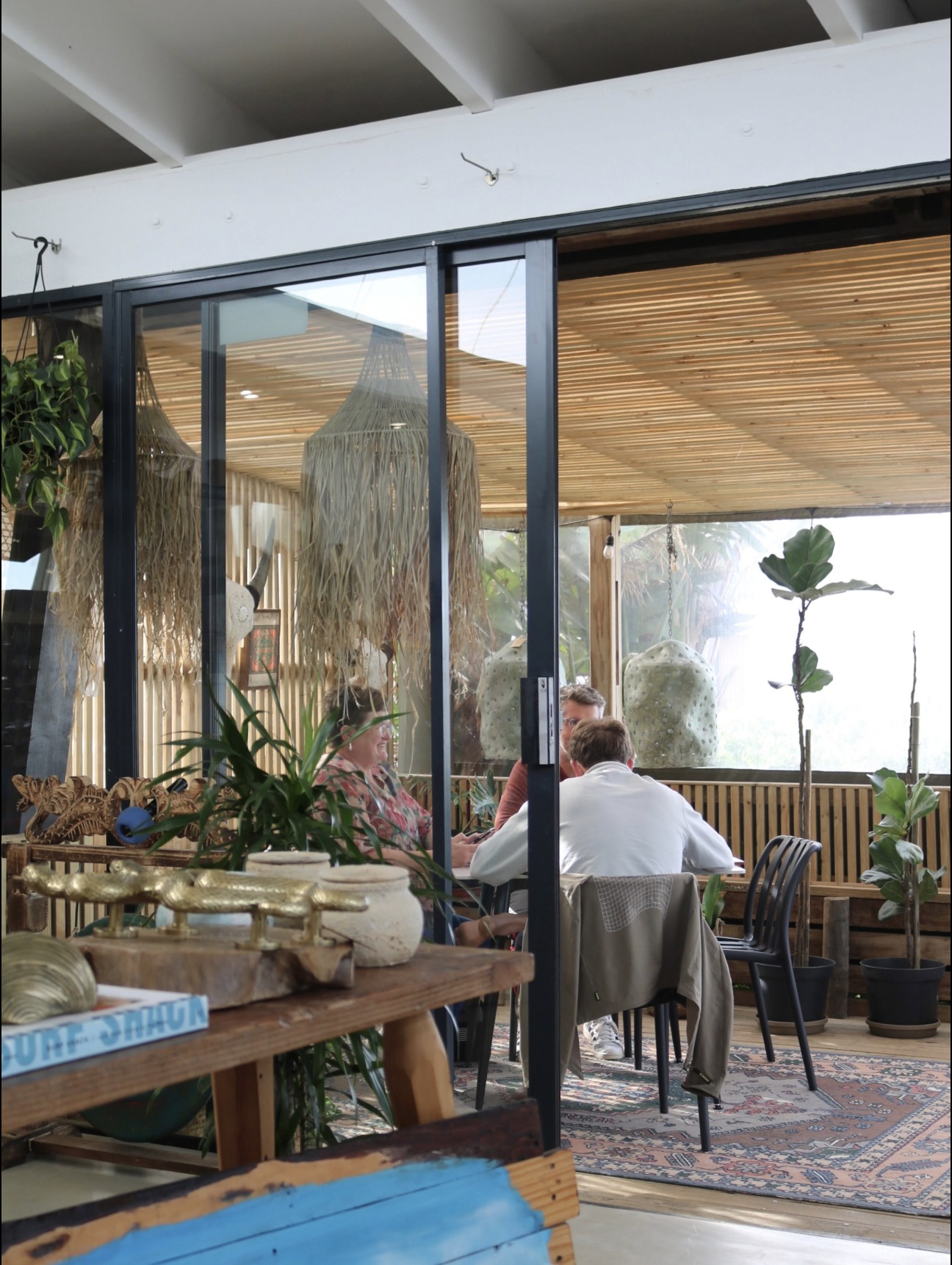 Morning light through the sliding doors of the café